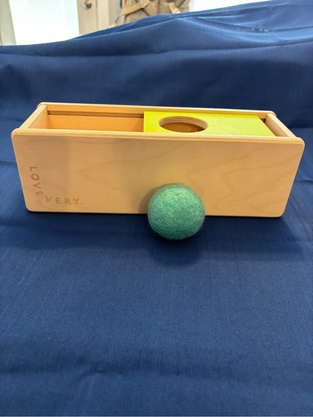 Lovevery Wooden Sliding Object Permanence Box with Blue Felt Ball